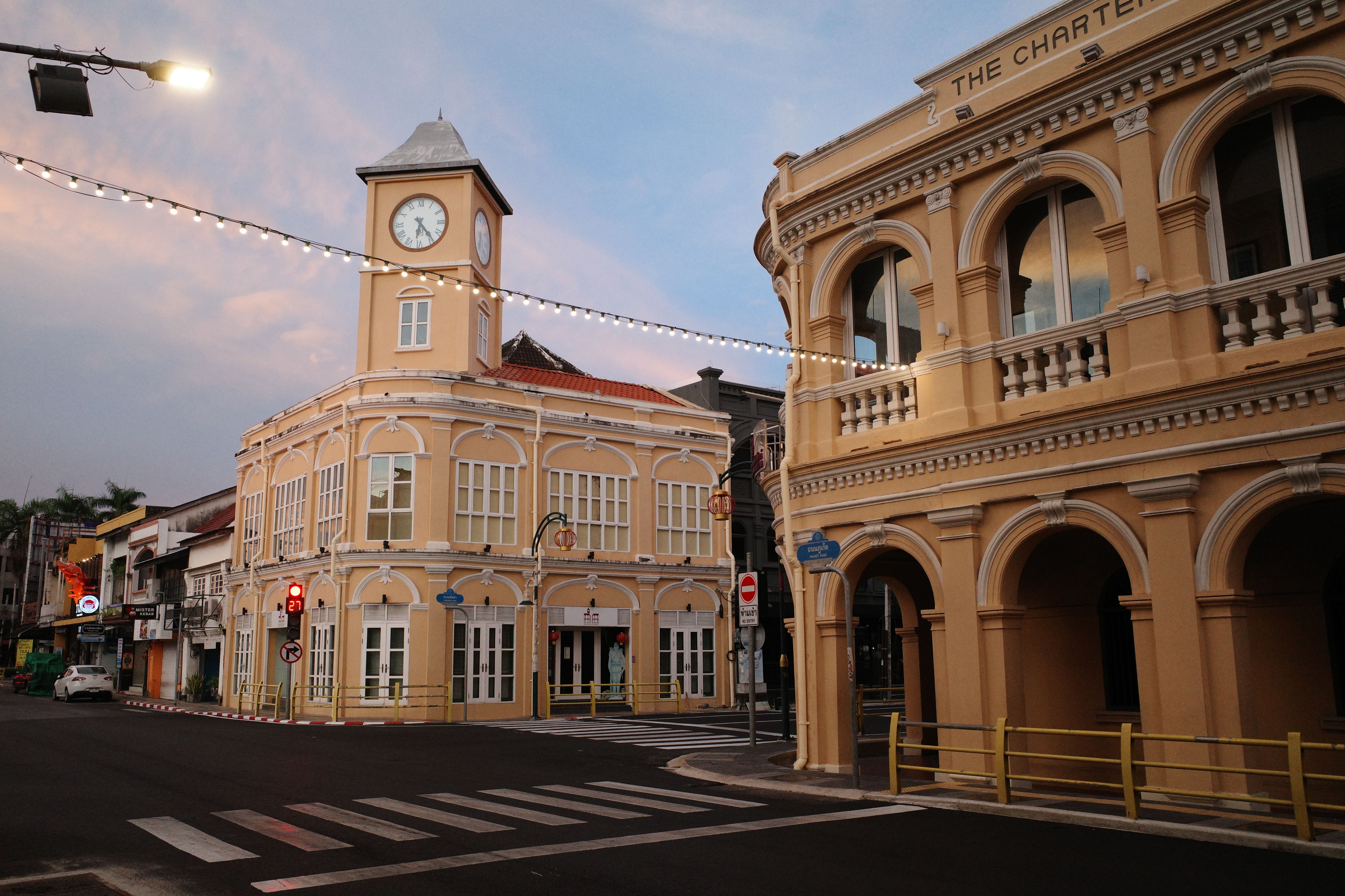 The clock tower and Sino-Portuguese shophouses of Phuket Old Town at dusk